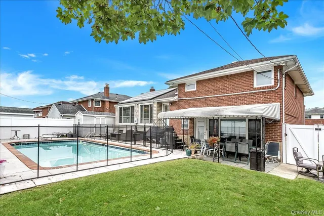 a view of a house with a yard porch and sitting area