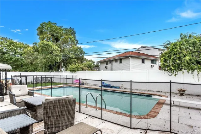 a balcony with furniture and a potted plant