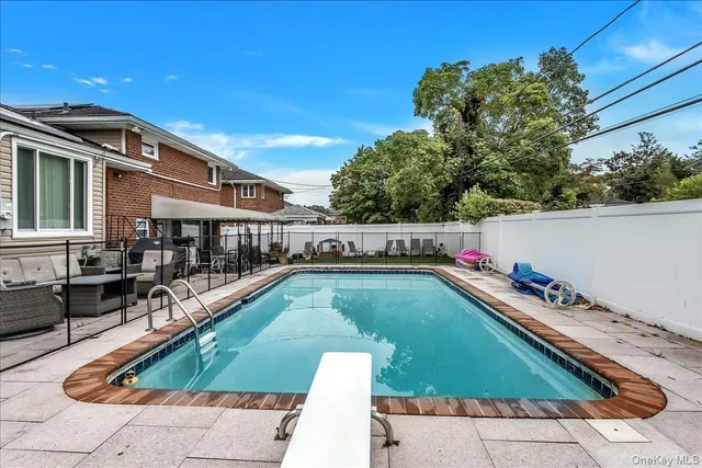 a view of swimming pool with chairs