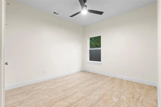 an empty room with a empty space and a window