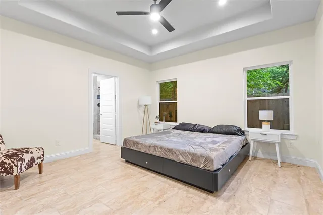 a bedroom with a bed and a table