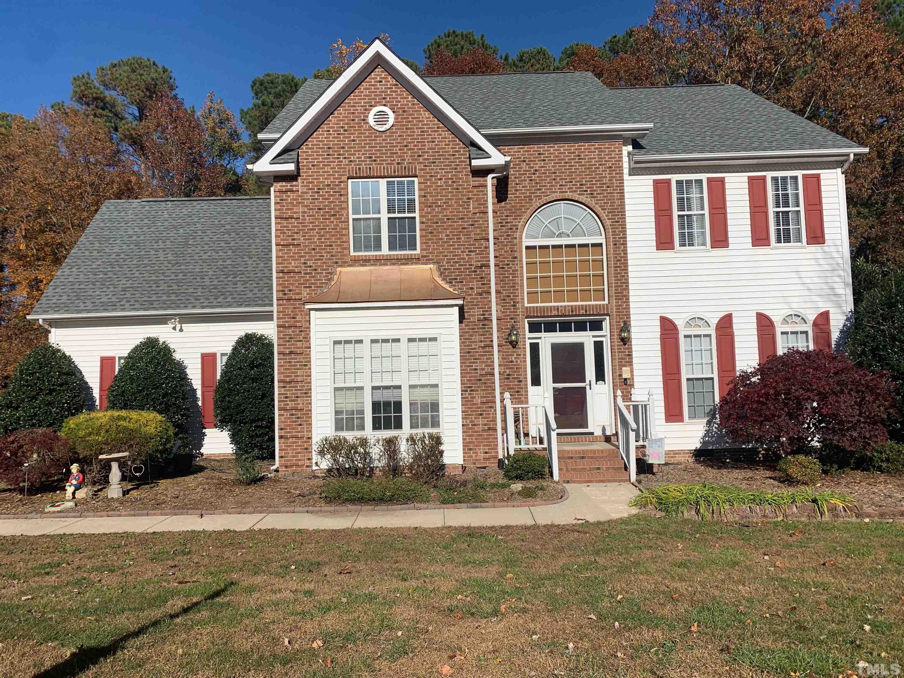 3545 Dewing Drive Raleigh, NC 27616 - Photo 1 of 13 a front view of a house with a yard