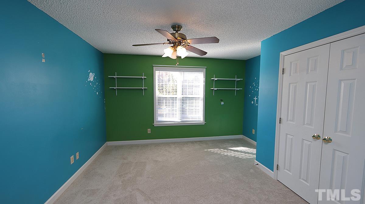 3545 Dewing Drive Raleigh, NC 27616 - Photo 10 of 13 a view of a room that has a fan and window in it