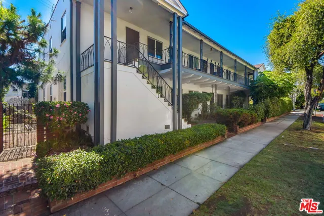 a view of a building with a yard