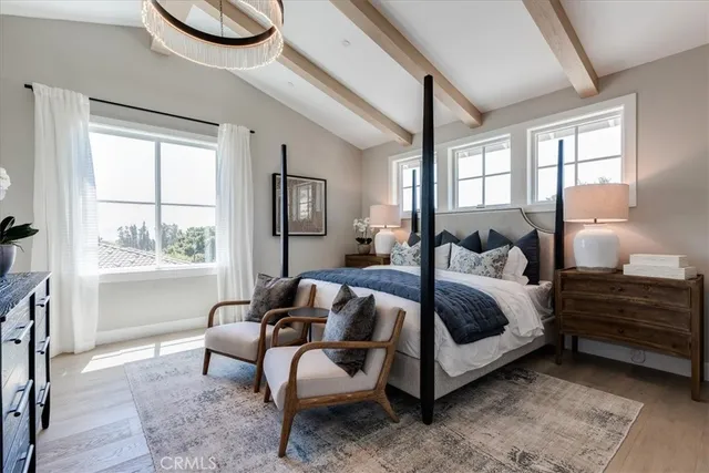 a bedroom with bed and a window