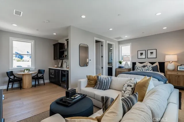 a spacious bedroom with a bed and a night stand