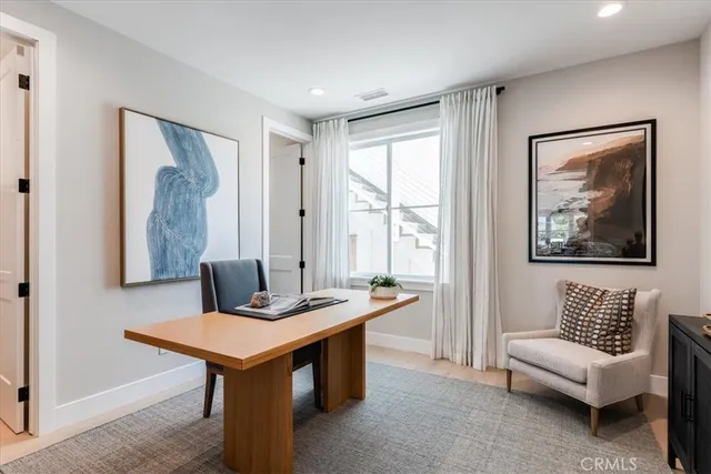 a view of a livingroom with furniture and window