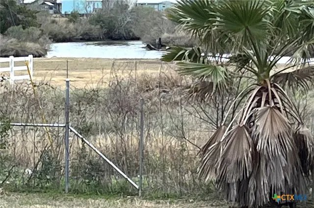 a view of swimming pool with a yard