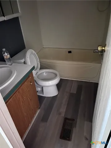 a bathroom with a sink and a toilet
