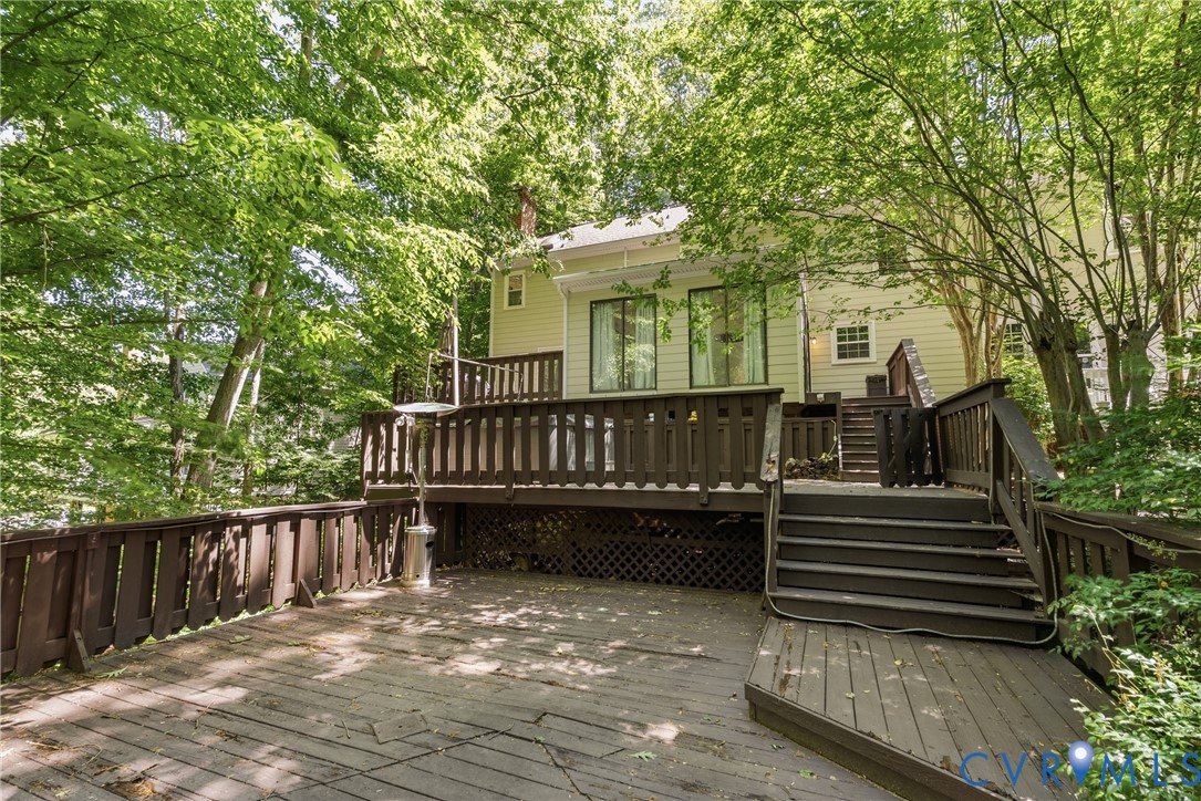 14321 Crossings Ridge Drive Midlothian, VA 23113 - Photo 41 of 43 a view of a house with wooden deck and a trees