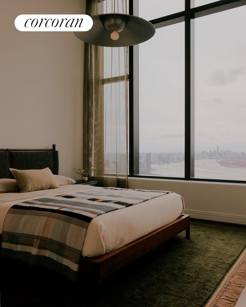 430 East 58th Street, Unit 70 Manhattan, NY 10022 - Photo 9 of 24 a bedroom with a bed and a window