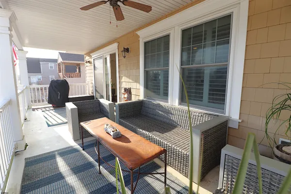 a view of a chair and table on the deck
