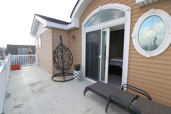 a view of a balcony with a swing