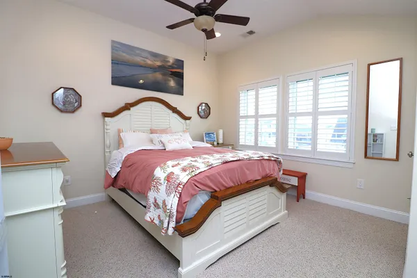 a view of a hallway and a livingroom with a floor to ceiling window
