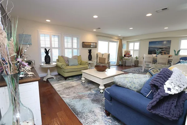 a living room with furniture rug and window