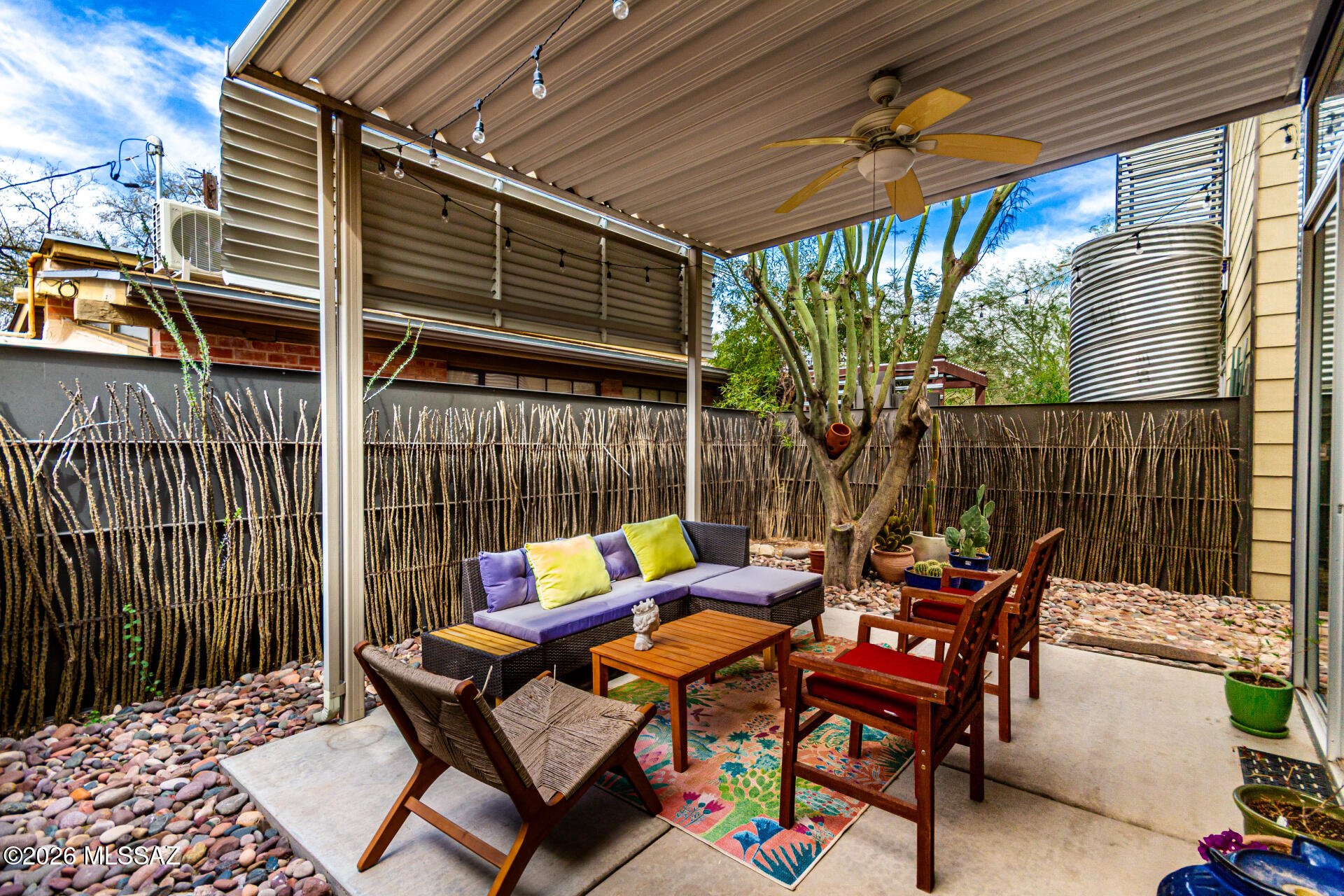 3605 East 3rd Street Tucson, AZ 85716 - Photo 34 of 39 Shaded back patio, perfect space for hosting guests! Featuring a water harvesting system and storage shed.