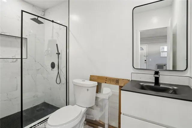 a large white kitchen with a sink