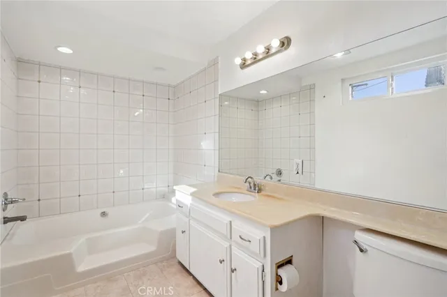 a bathroom with a shower and a glass door