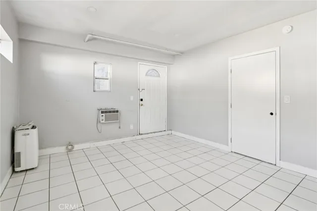 a view of an empty room and window