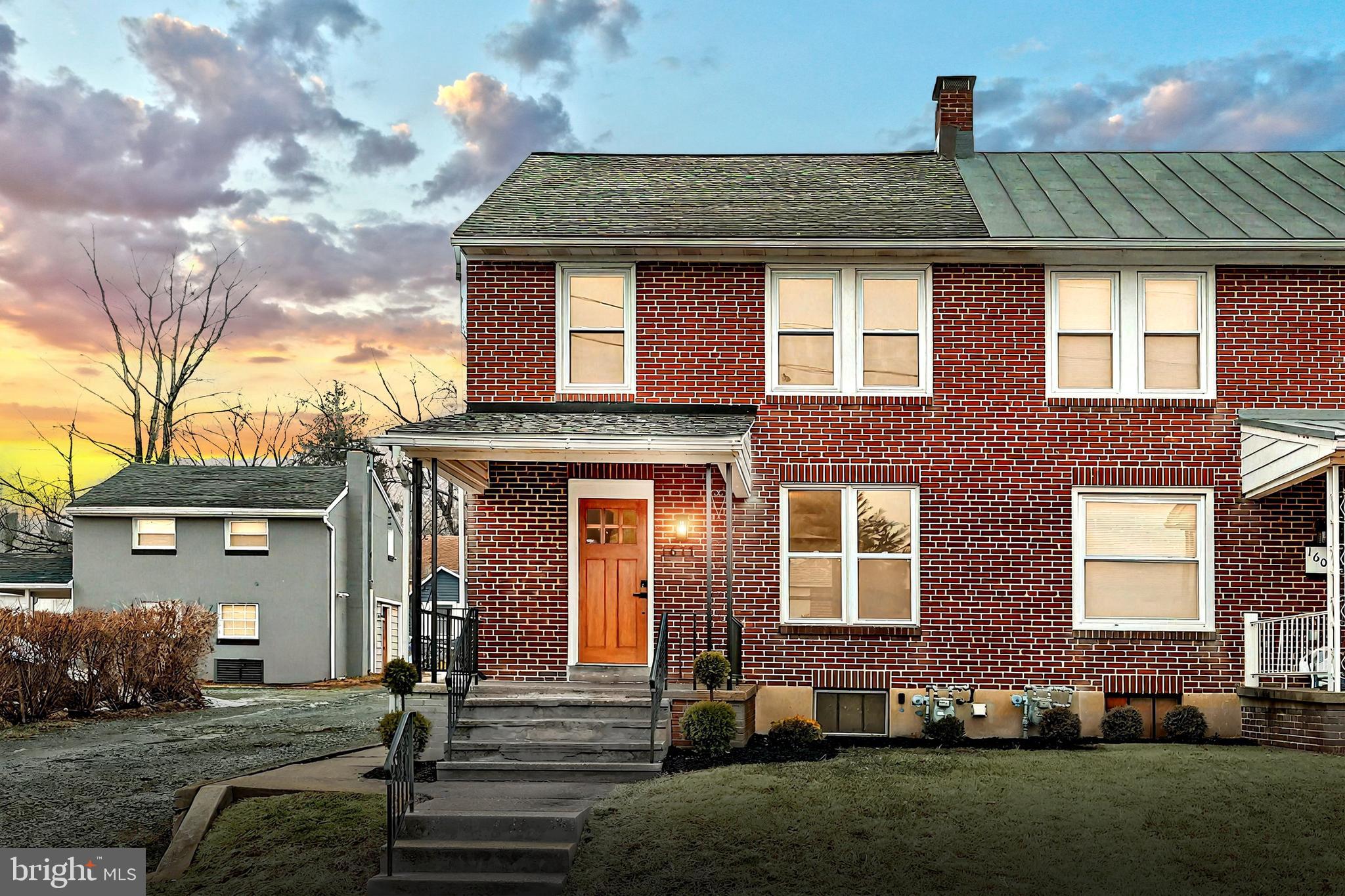 1611 Meade Street Reading, PA 19607 - Photo 1 of 59 a front view of a house with garden