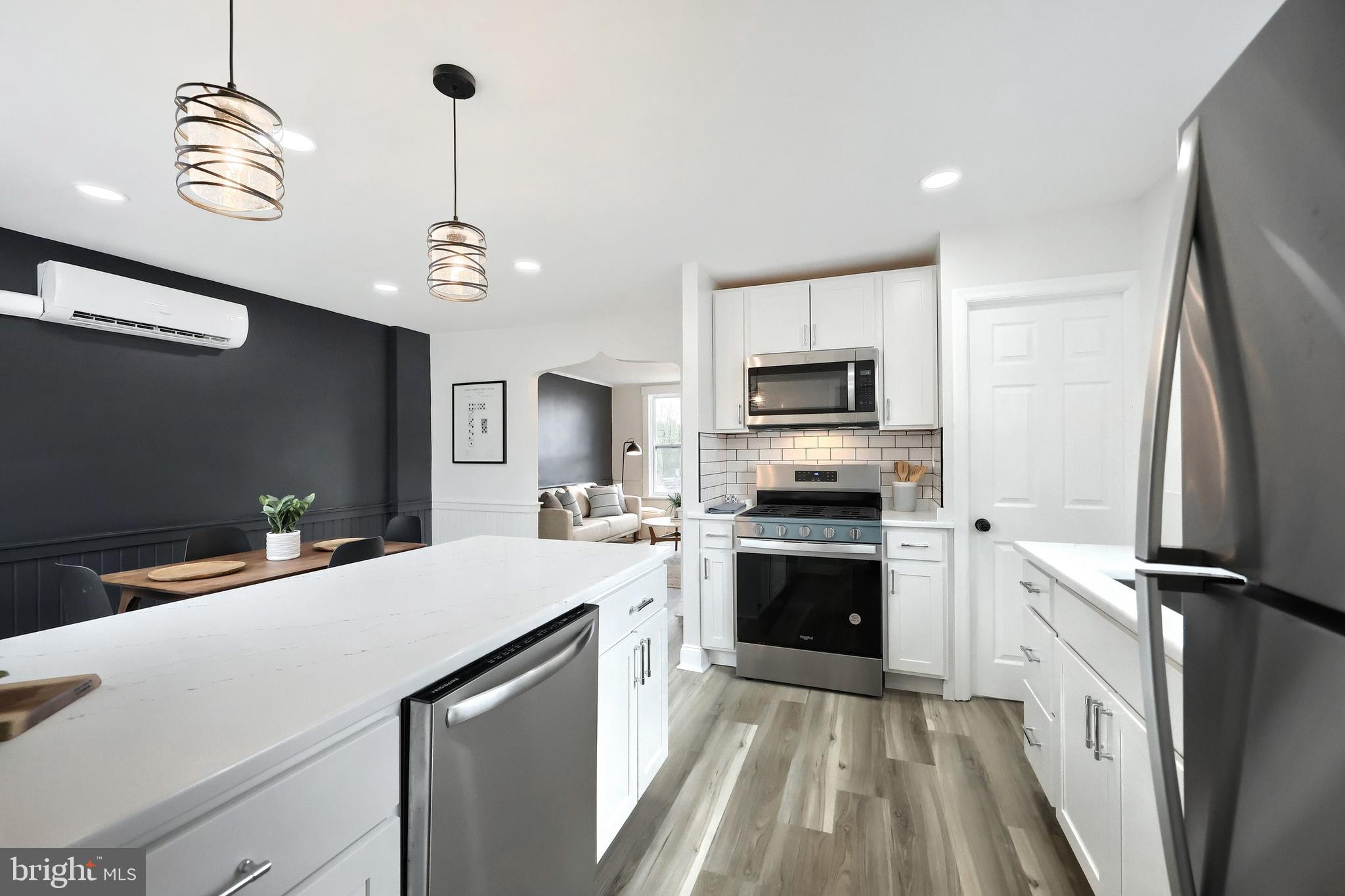 1611 Meade Street Reading, PA 19607 - Photo 22 of 59 a kitchen with a sink stainless steel appliances and cabinets