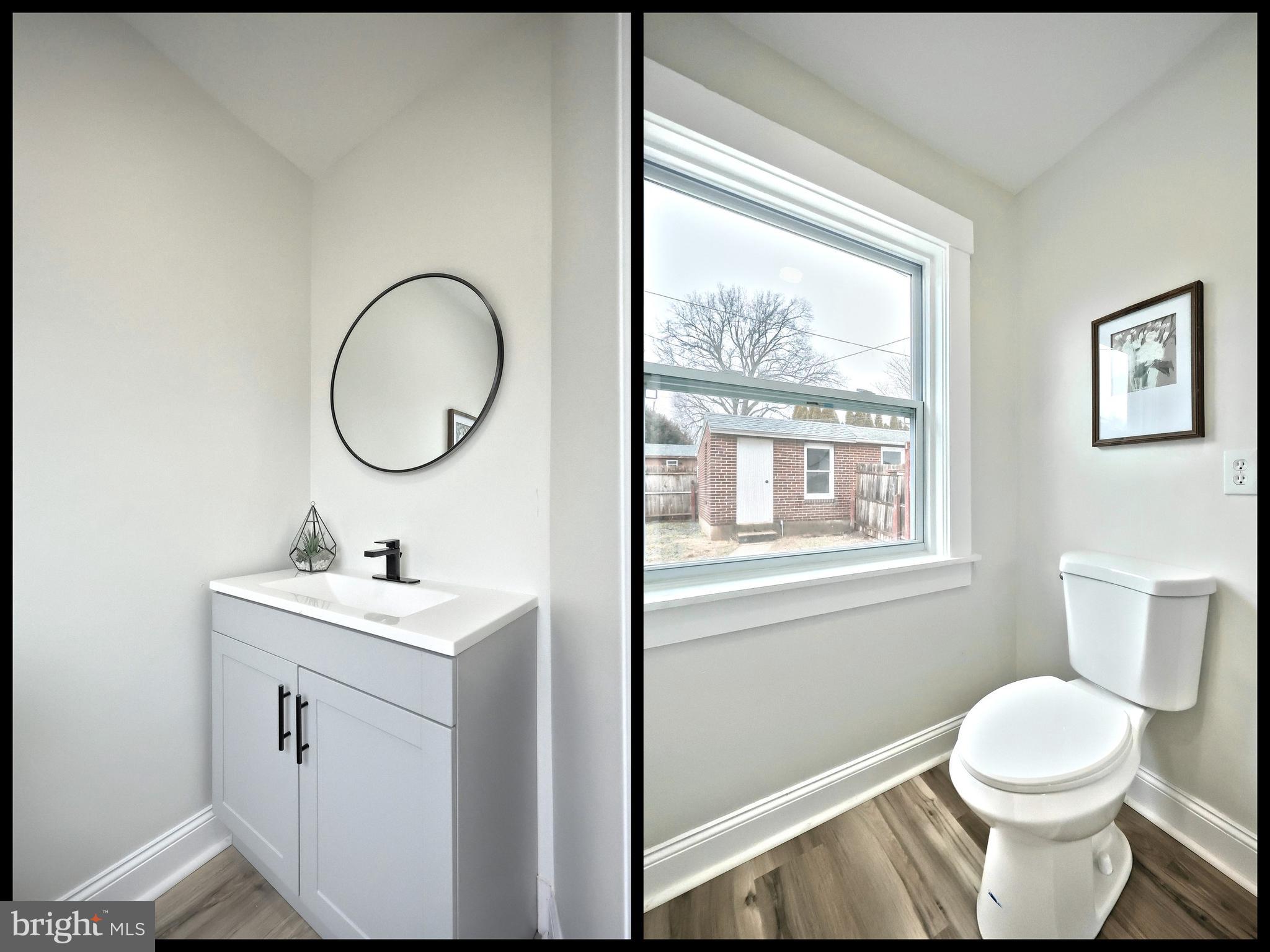 1611 Meade Street Reading, PA 19607 - Photo 24 of 59 a bathroom with a toilet a sink a mirror and a window