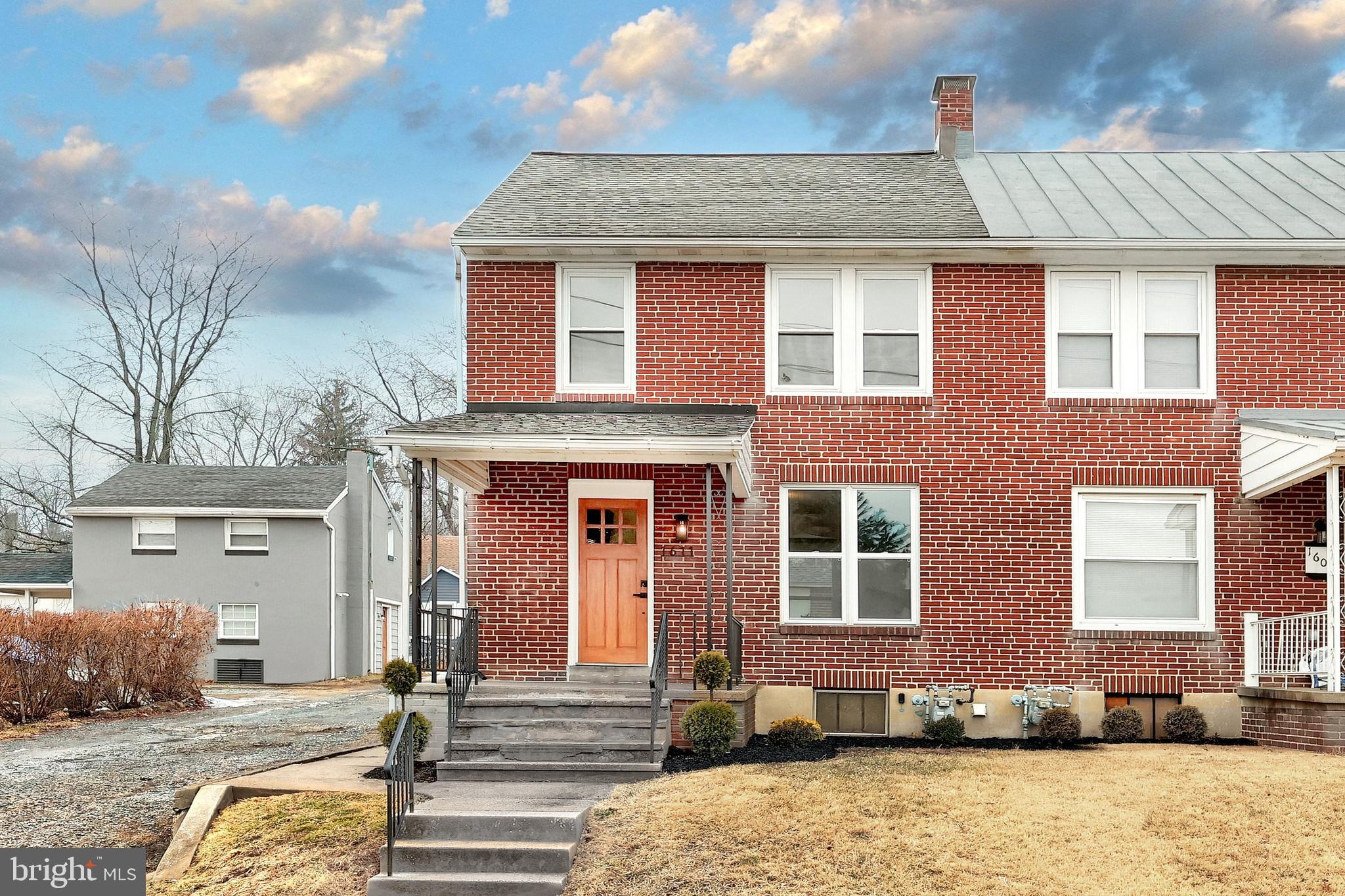 1611 Meade Street Reading, PA 19607 - Photo 3 of 59 a front view of a house with a yard