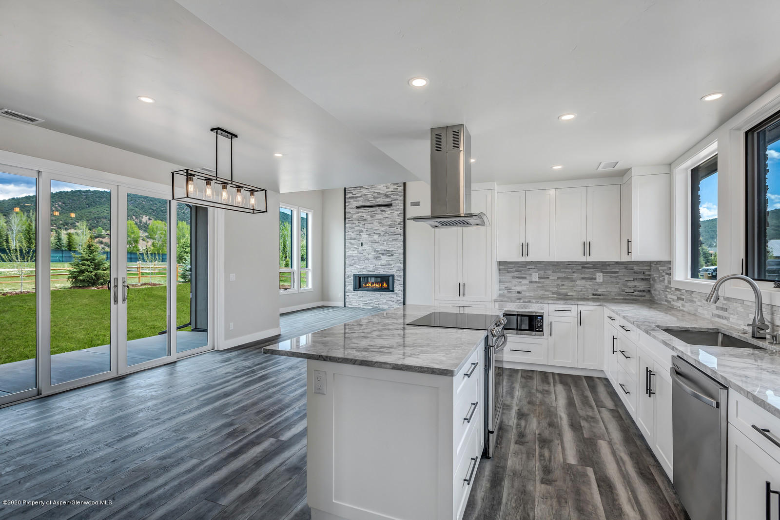 347 Equestrian Way Carbondale, CO 81623 - Photo 11 of 31 a kitchen with stainless steel appliances granite countertop a sink stove and refrigerator