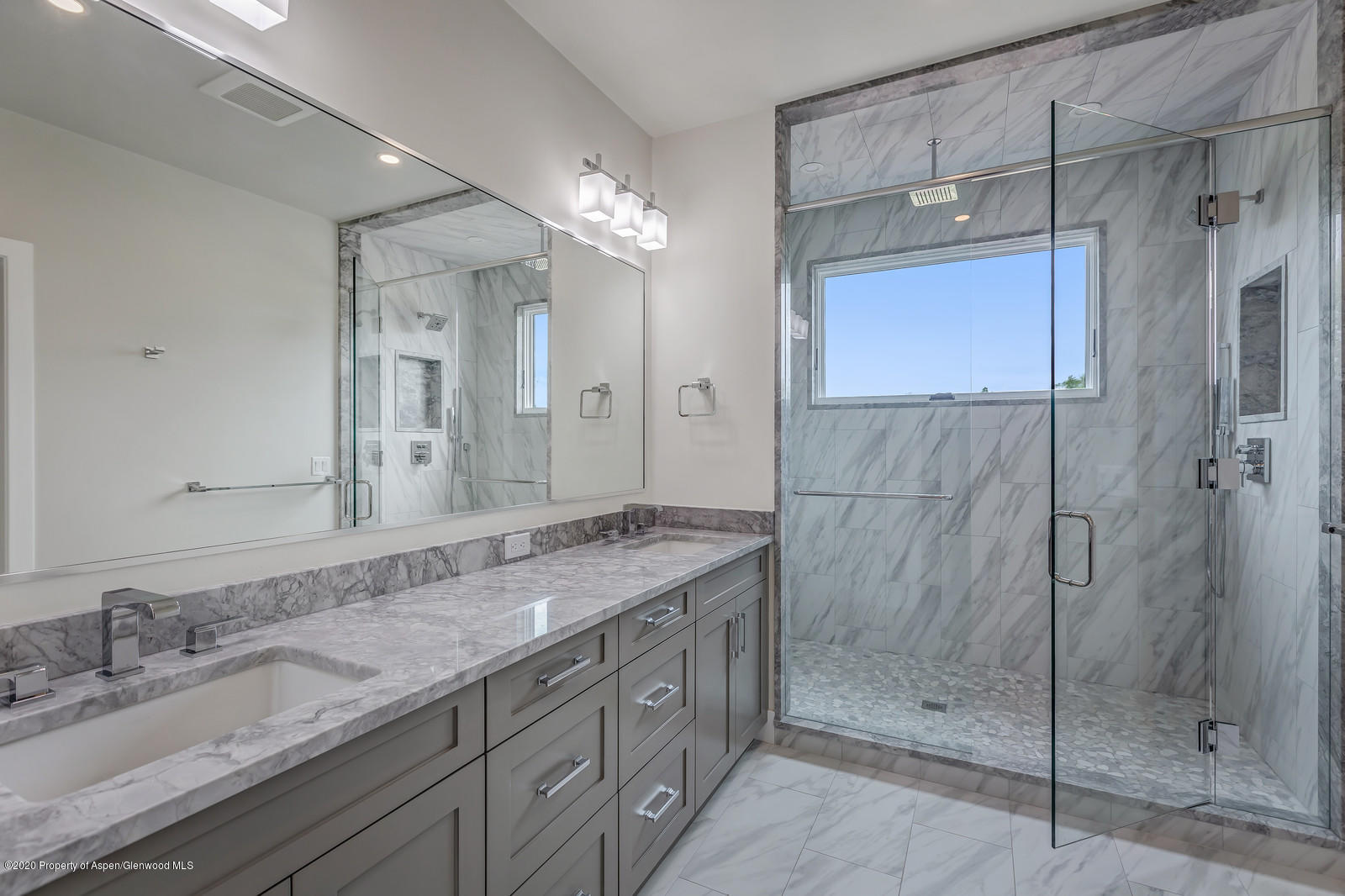 347 Equestrian Way Carbondale, CO 81623 - Photo 17 of 31 a bathroom with a granite countertop shower sink and mirror