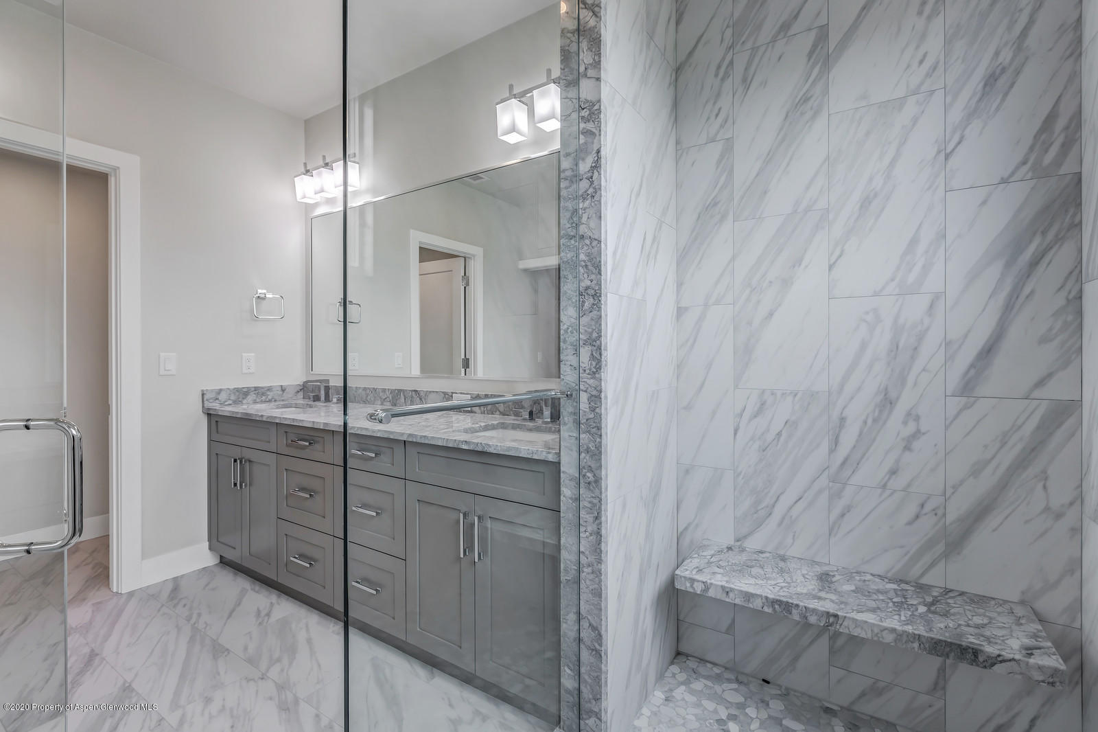 347 Equestrian Way Carbondale, CO 81623 - Photo 18 of 31 a bathroom with a granite countertop sink a mirror and a shower