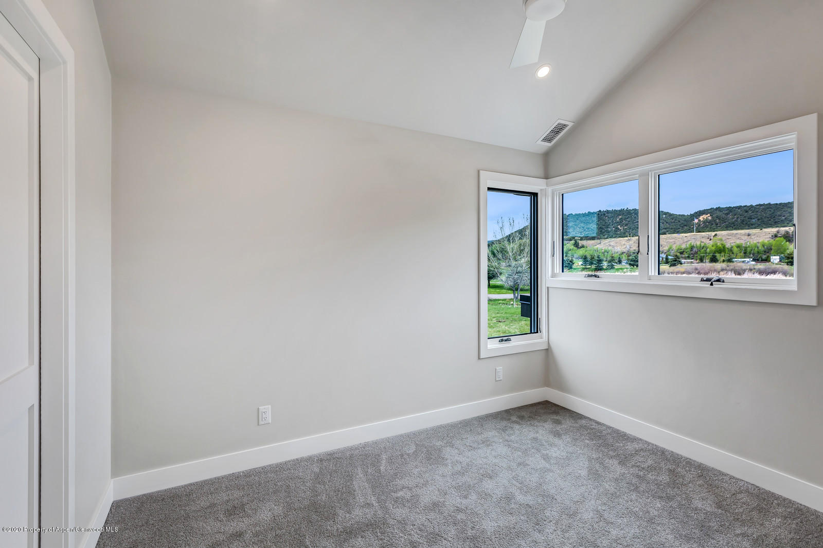 347 Equestrian Way Carbondale, CO 81623 - Photo 22 of 31 an empty room with large windows