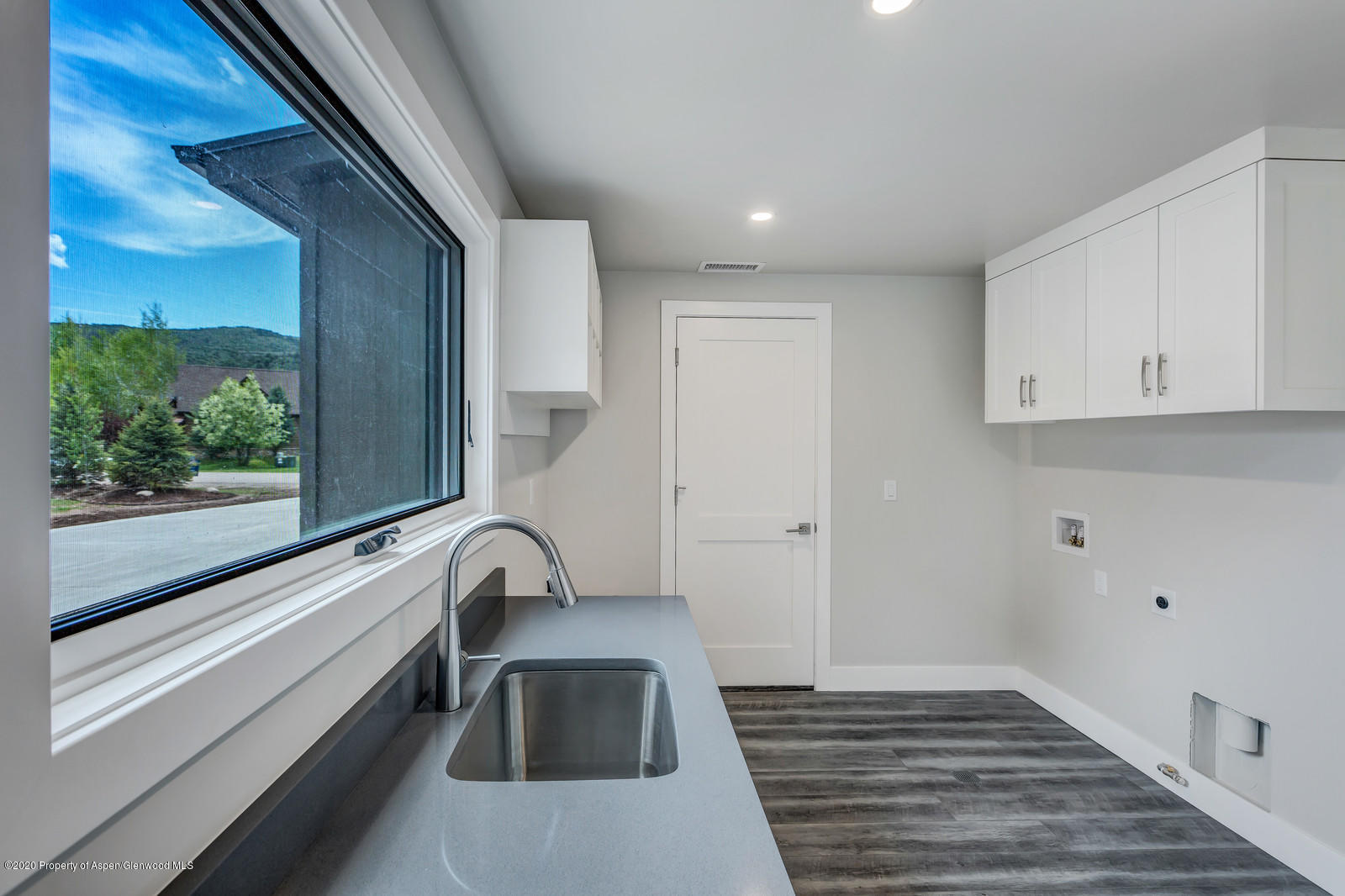 347 Equestrian Way Carbondale, CO 81623 - Photo 25 of 31 a view of a sink and dishwasher with wooden floor