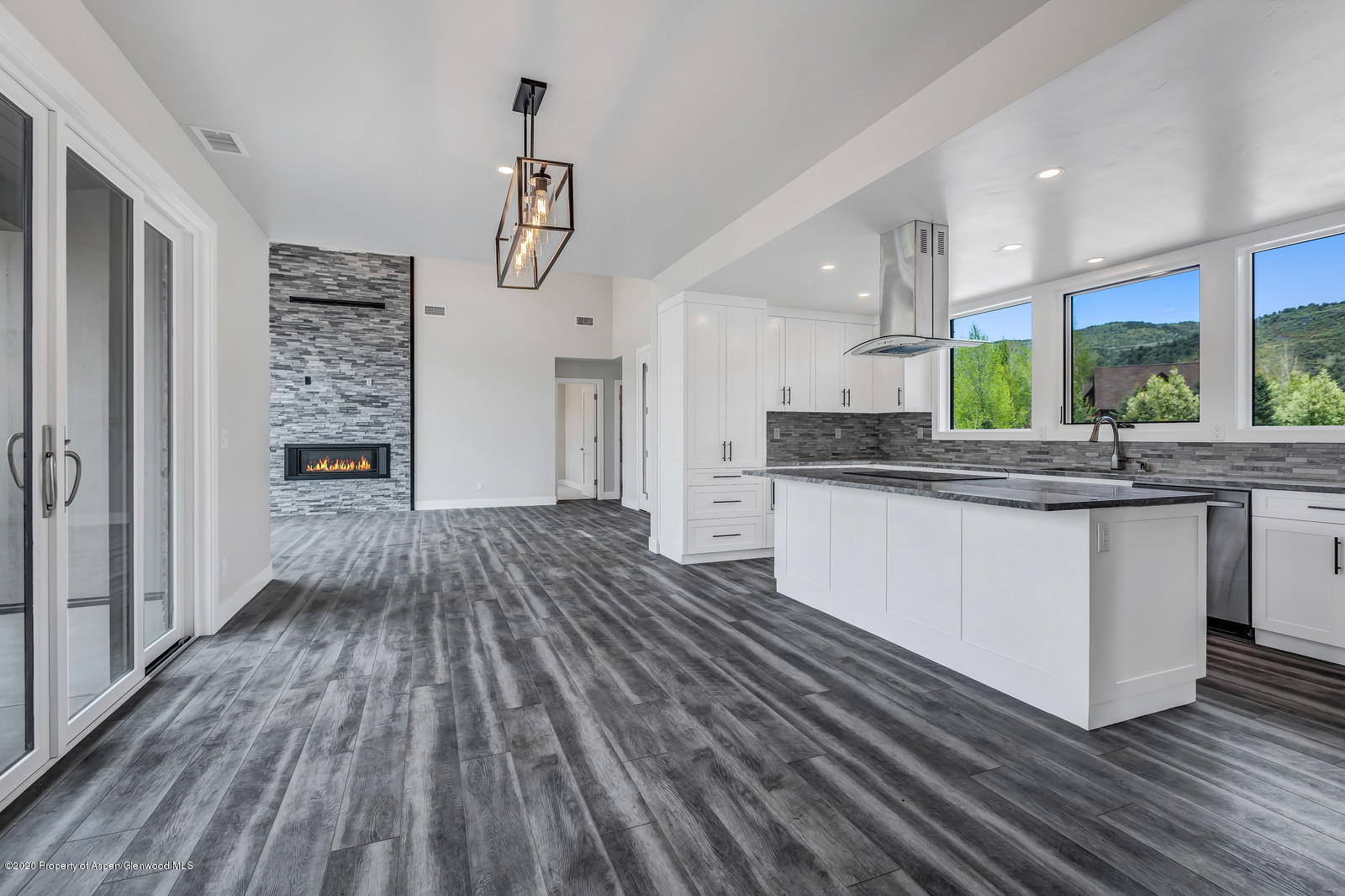 347 Equestrian Way Carbondale, CO 81623 - Photo 6 of 31 a kitchen with stainless steel appliances kitchen island granite countertop a stove a sink and a refrigerator