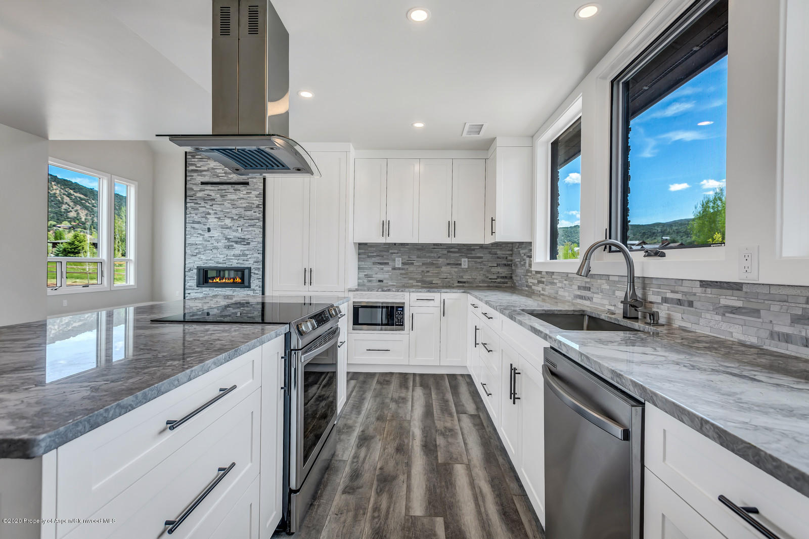 347 Equestrian Way Carbondale, CO 81623 - Photo 9 of 31 a kitchen with a sink stove and cabinets