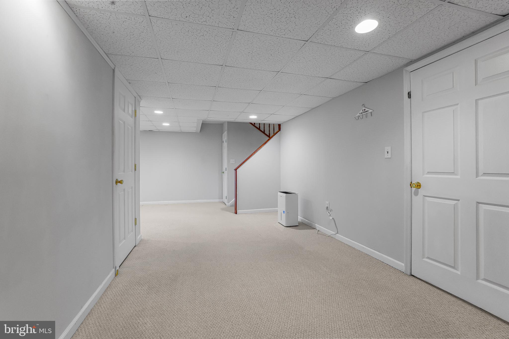 363 Chickory Way Newark, DE 19711 - Photo 13 of 17 an empty room with white walls and stairs