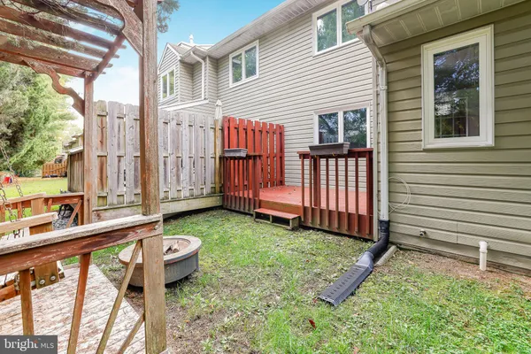 a backyard of a house with barbeque oven