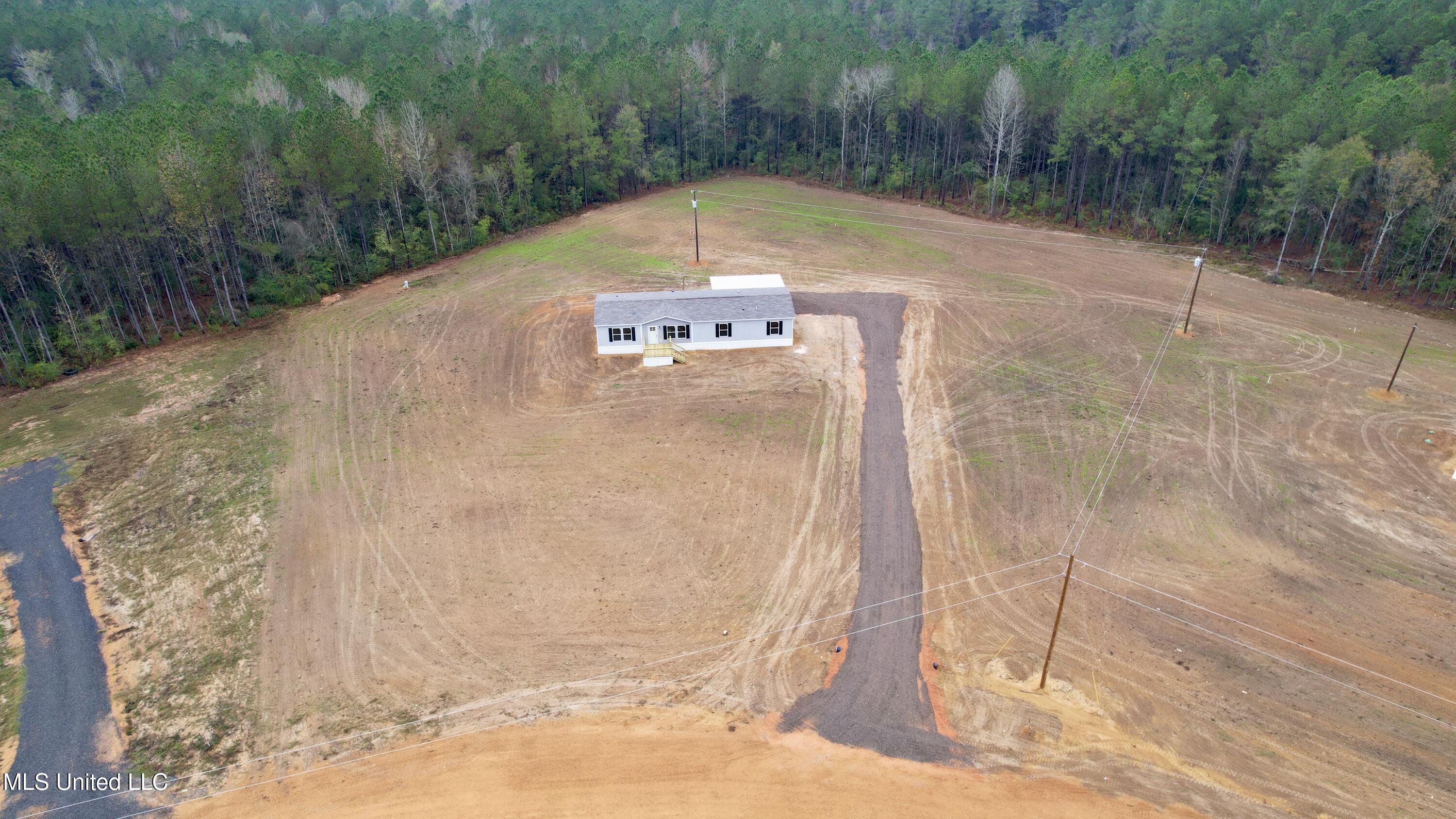 2033 Ceasar Trail Summit, MS 39666 - Photo 25 of 31 dji_fly_20251125_090136_995_176408333787