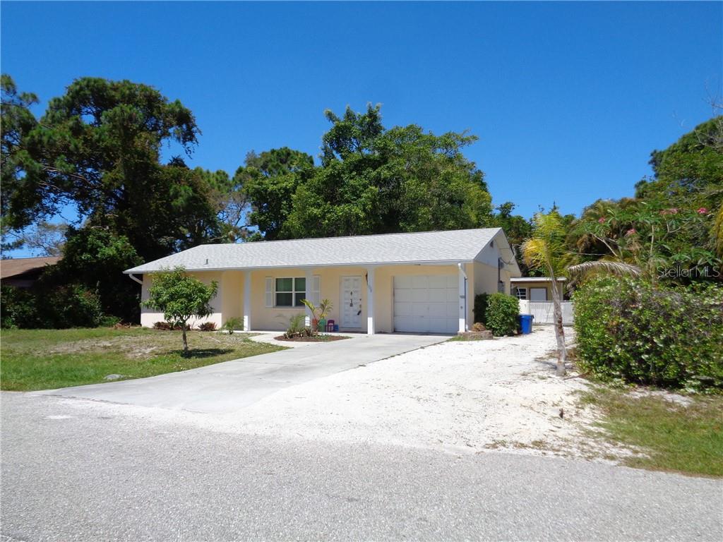 1138 Fundy Road Venice, FL 34293 - Photo 1 of 1 a view of a house with backyard and trees