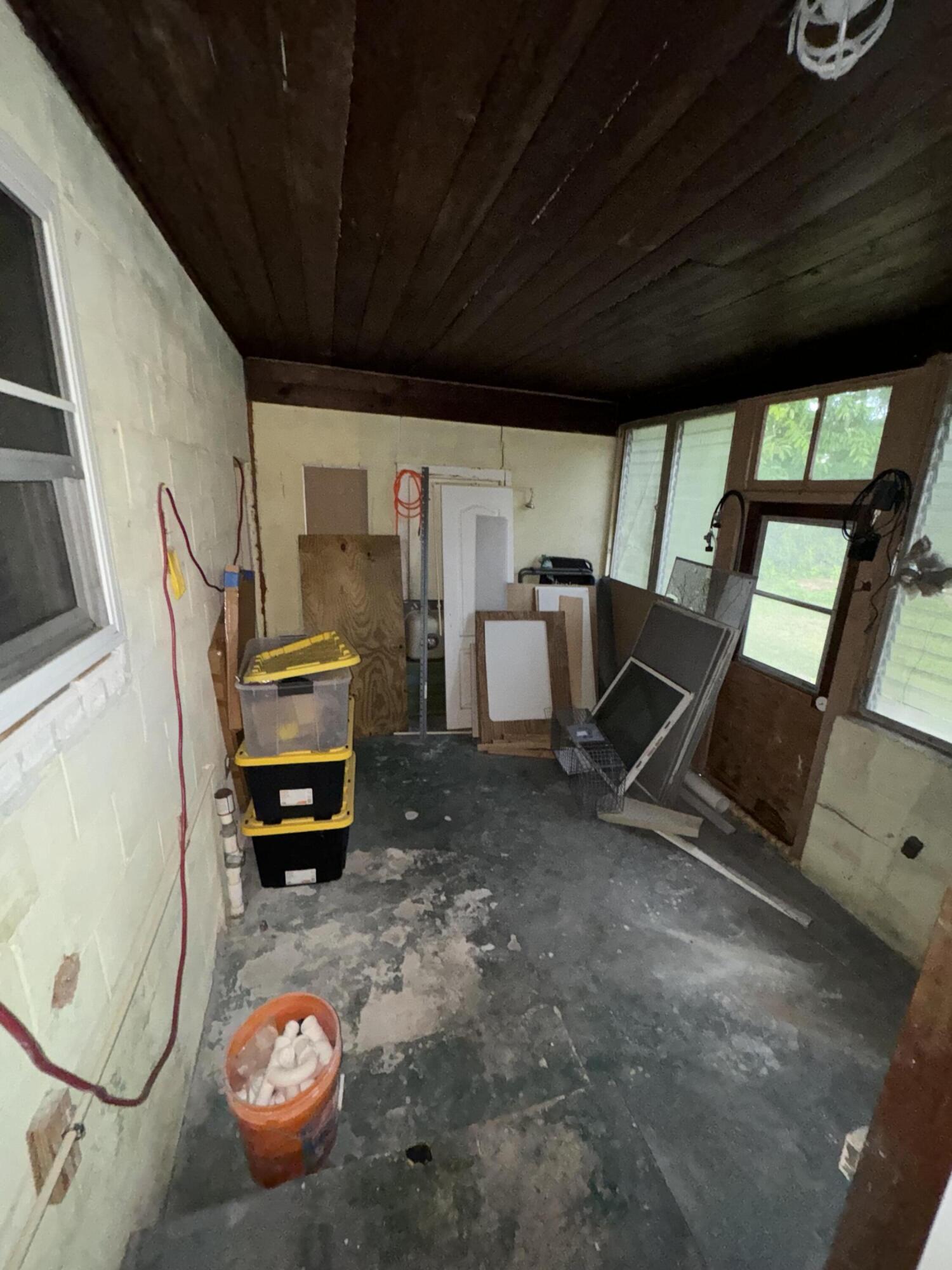 1825 Palm Boulevard Melbourne, FL 32901 - Photo 16 of 25 a view of living room with furniture and a floor to ceiling window