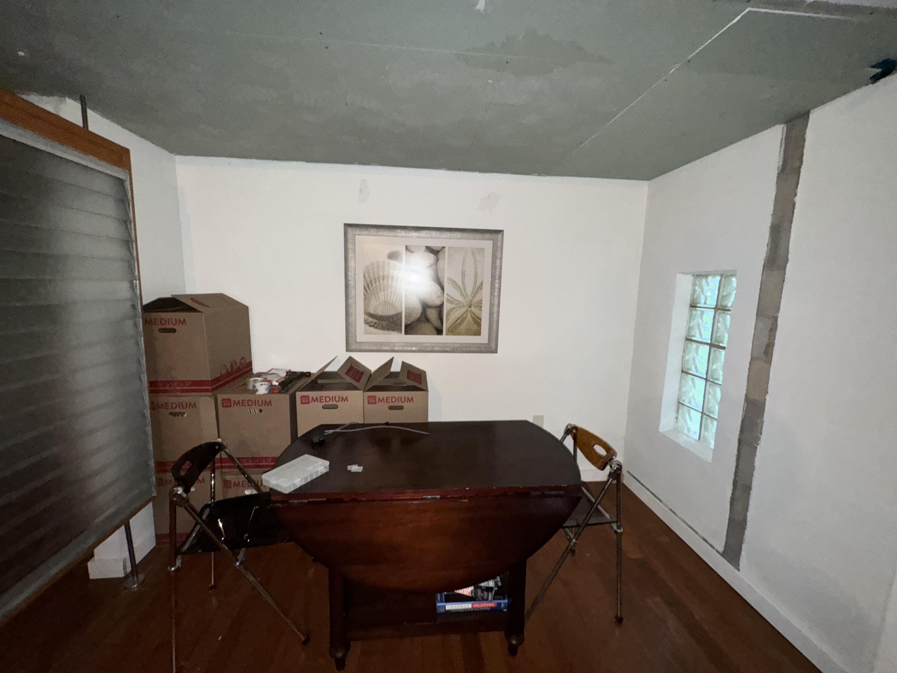 1825 Palm Boulevard Melbourne, FL 32901 - Photo 20 of 25 a work room with furniture and a window