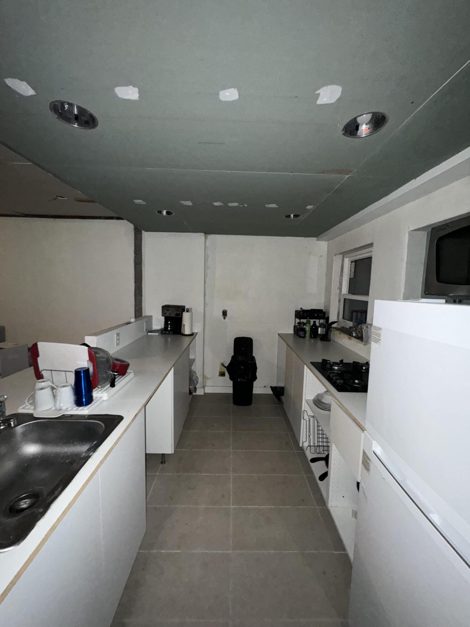 1825 Palm Boulevard Melbourne, FL 32901 - Photo 8 of 25 a large kitchen with stainless steel appliances lots of counter top space