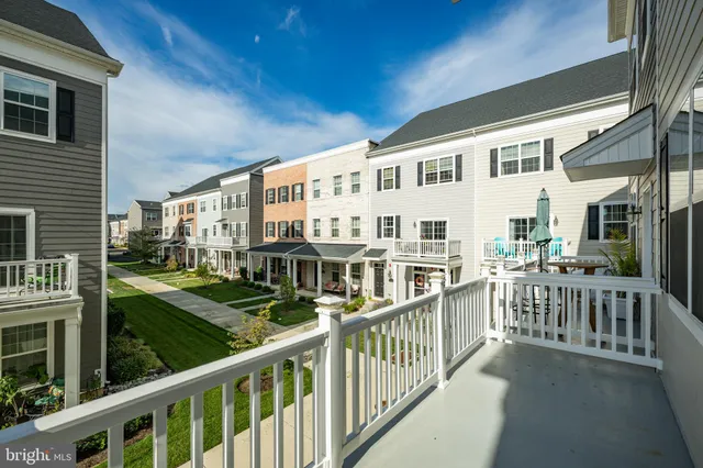a view of a house with wooden deck