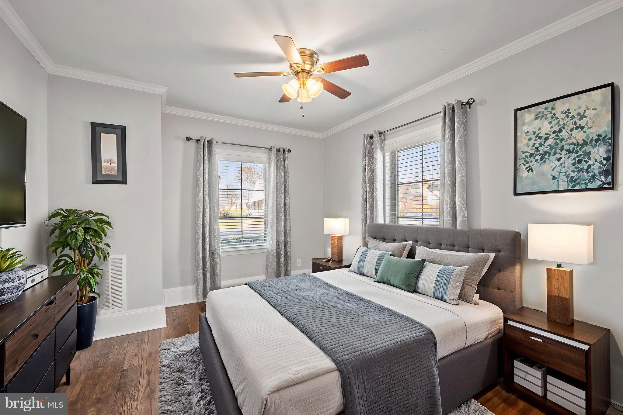 706 Fairview Avenue Frederick, MD 21701 - Photo 21 of 48 a bedroom with a bed and a chandelier