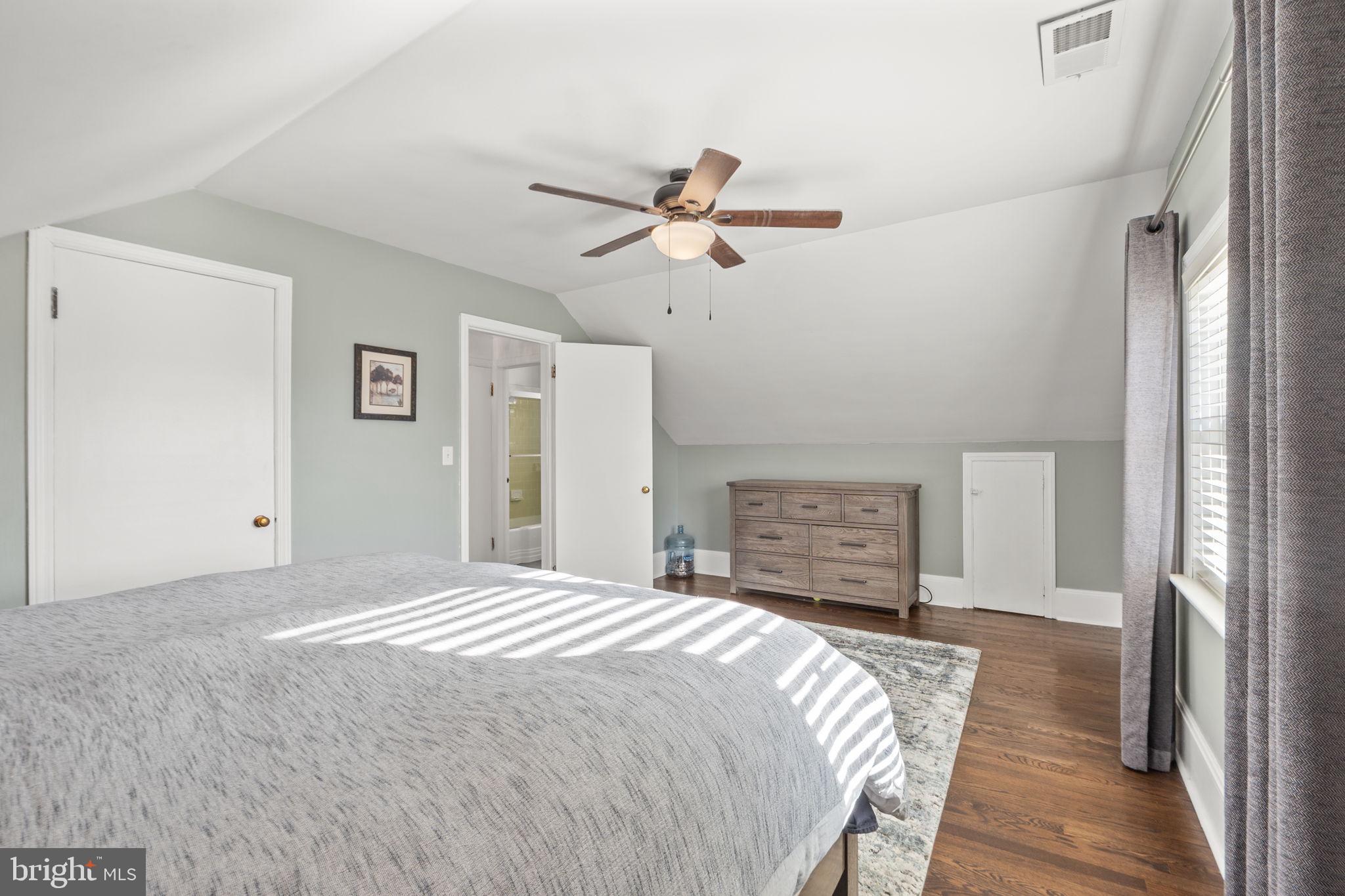 706 Fairview Avenue Frederick, MD 21701 - Photo 25 of 48 a bedroom with a bed and a chandelier