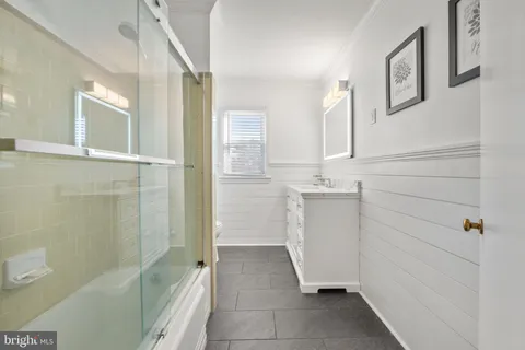 a bathroom with a sink and shower