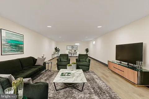 a view of a room with table and chairs