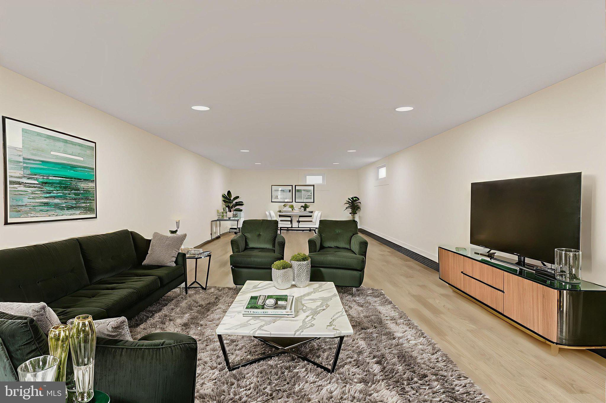 706 Fairview Avenue Frederick, MD 21701 - Photo 40 of 48 a living room with furniture and a flat screen tv