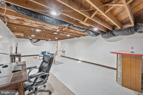a view of a deck with couches with wooden floor and city view
