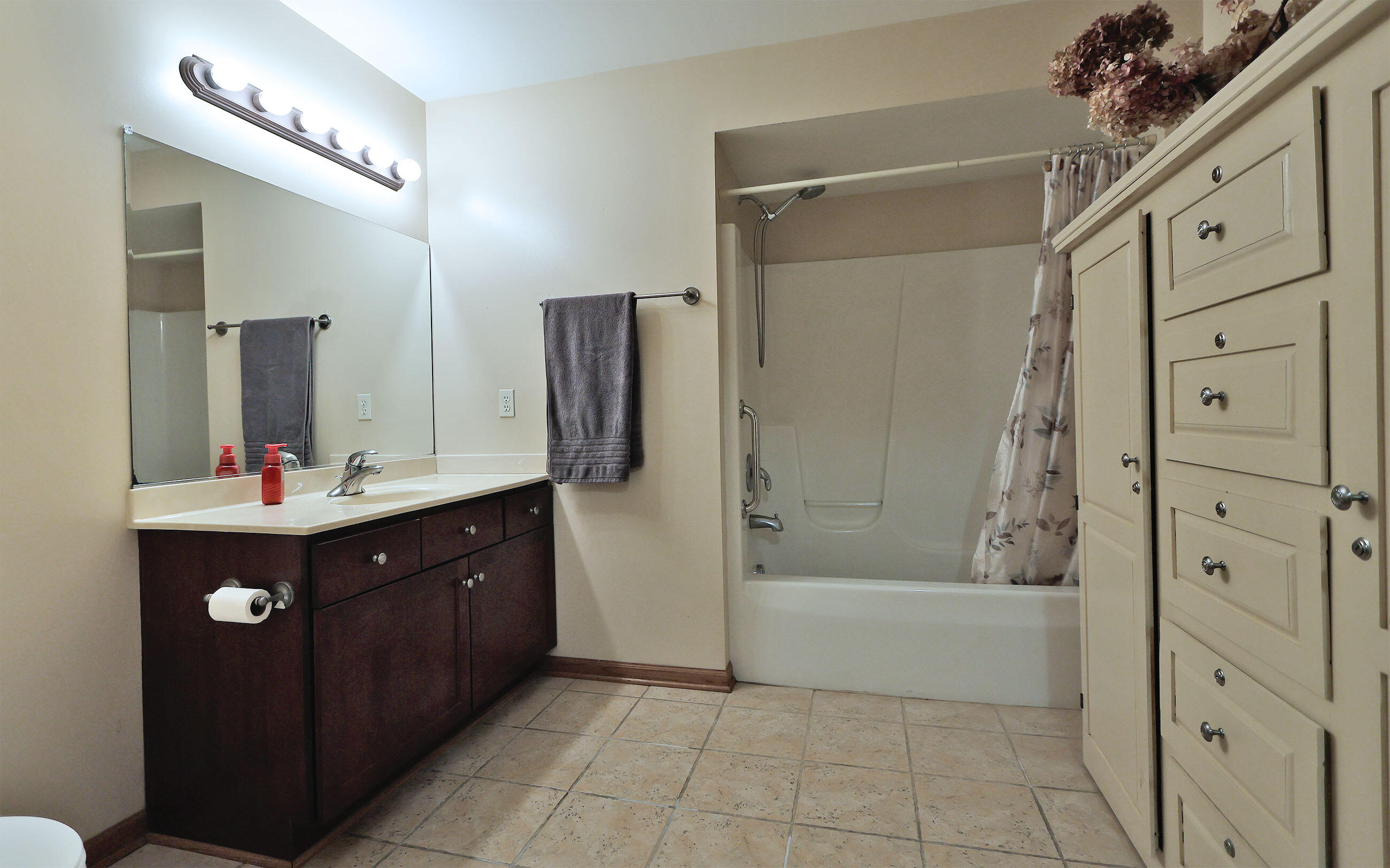 8856 Sheridan Road, Unit 1 Kenosha, WI 53143 - Photo 16 of 18 Large Second Bathroom with Shower over Tub and Built-in Cabinets