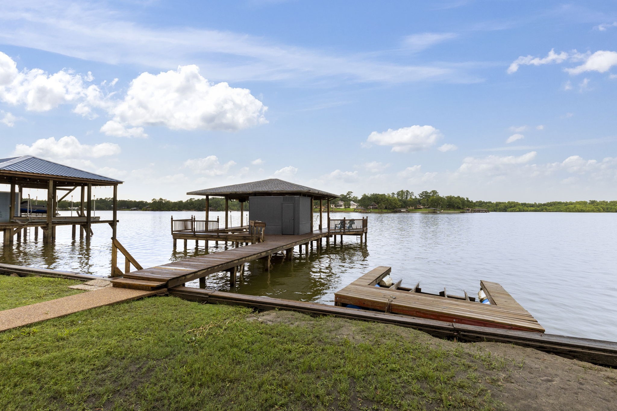 245 Lakeland Road Huntsville, TX 77320 - Photo 45 of 49 Enjoy lake adventures with a convenient boat house complete with a floating jet ski dock